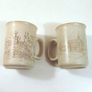 Set of 2 Manoir collection coffee mugs, church & cabin, SMALL CHIP